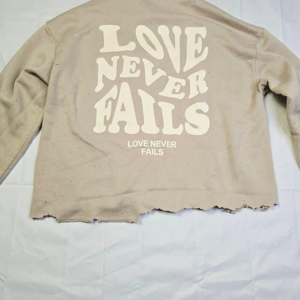 Men's Love Never Fails Fleece Hoodie Size M Beige Distressed Raw Hem T3